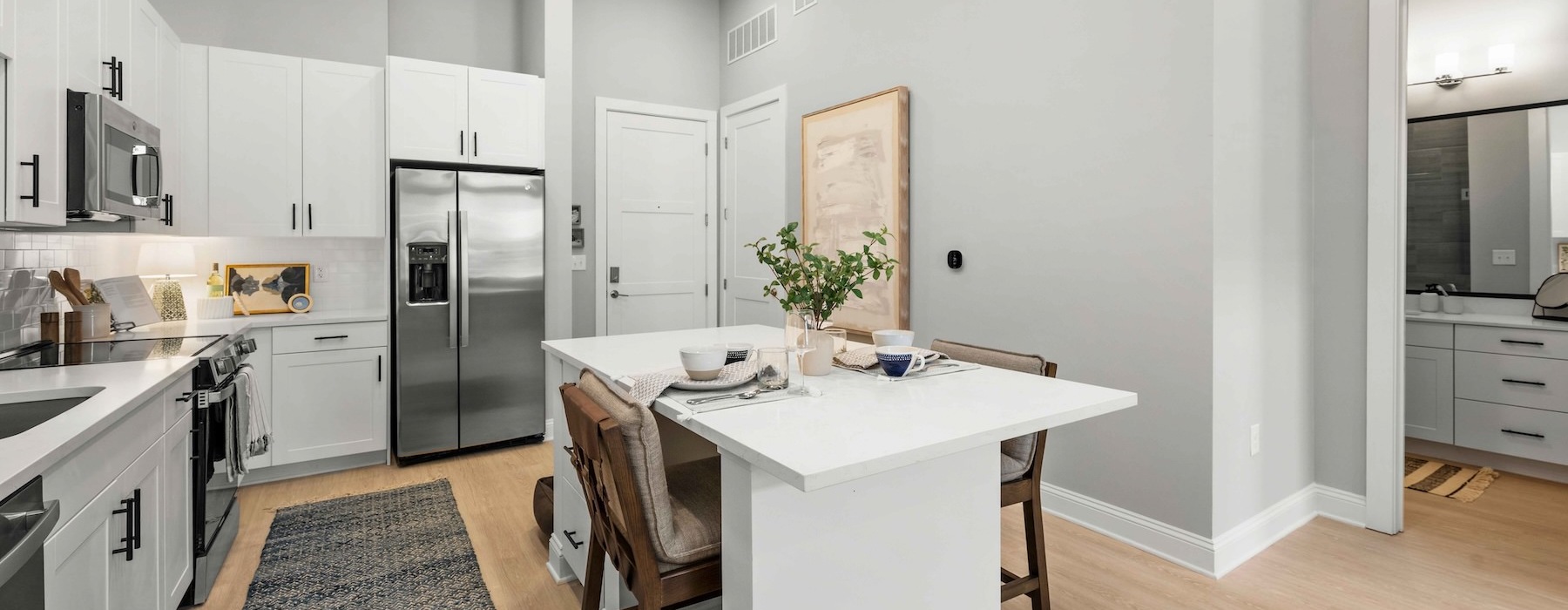 a kitchen with white cabinets