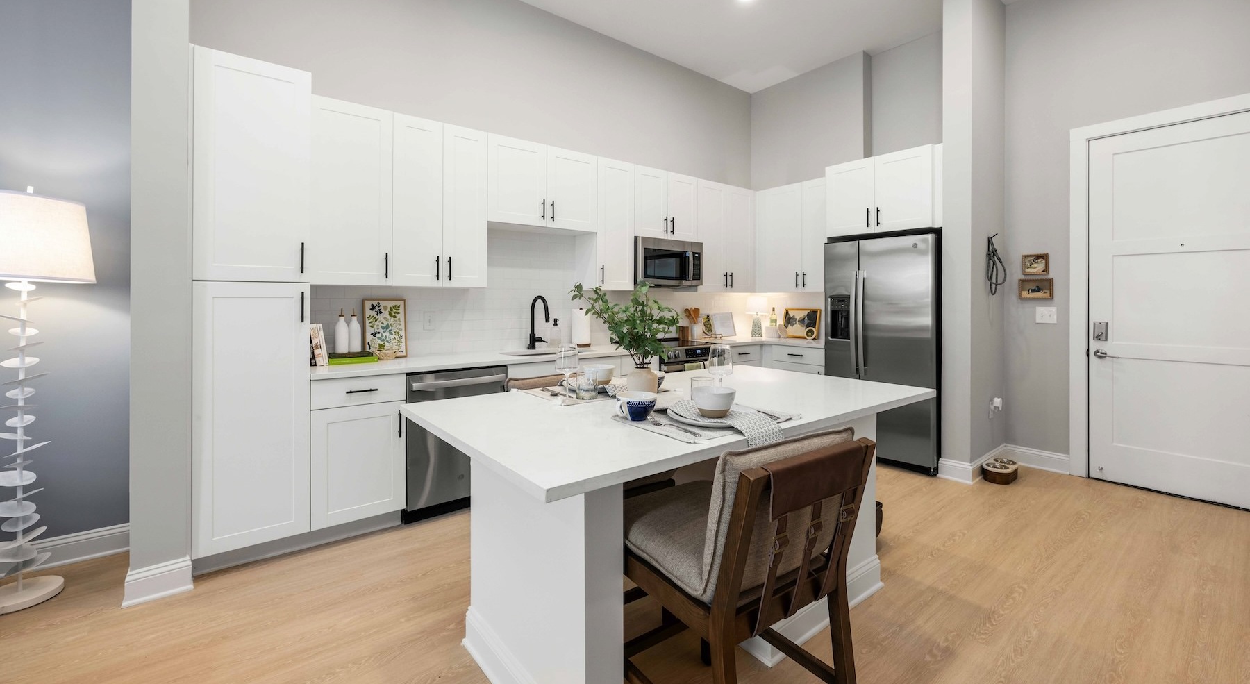 a kitchen with white cabinets