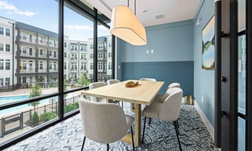 a private conference room with a long table and chairs