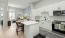 a kitchen with white cabients