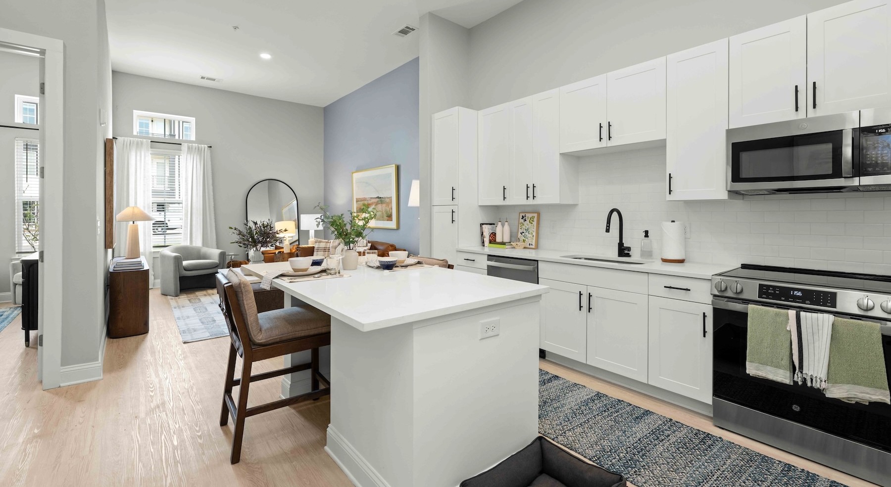 a kitchen with white cabients