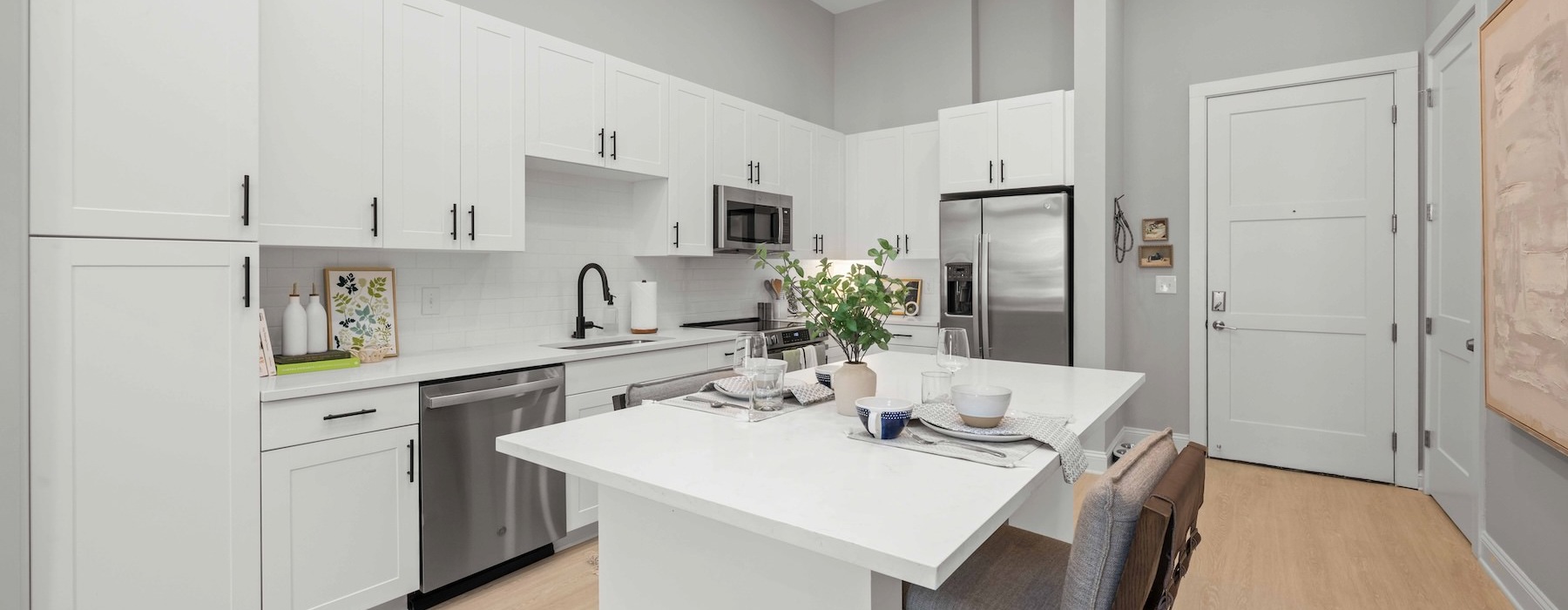 a kitchen with white cabinets