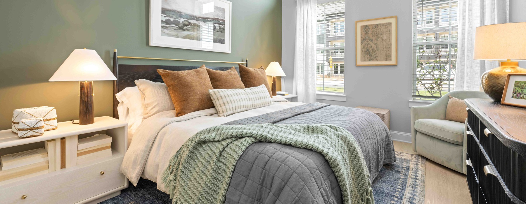 a bedroom with a chair and nightstands