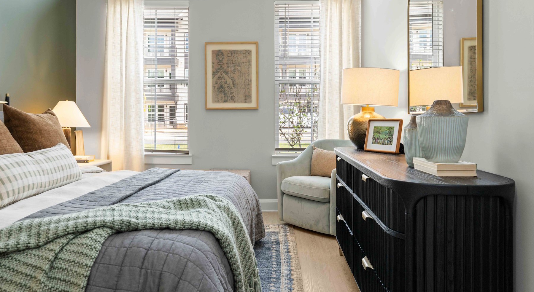 a bedroom with a bed and a dresser