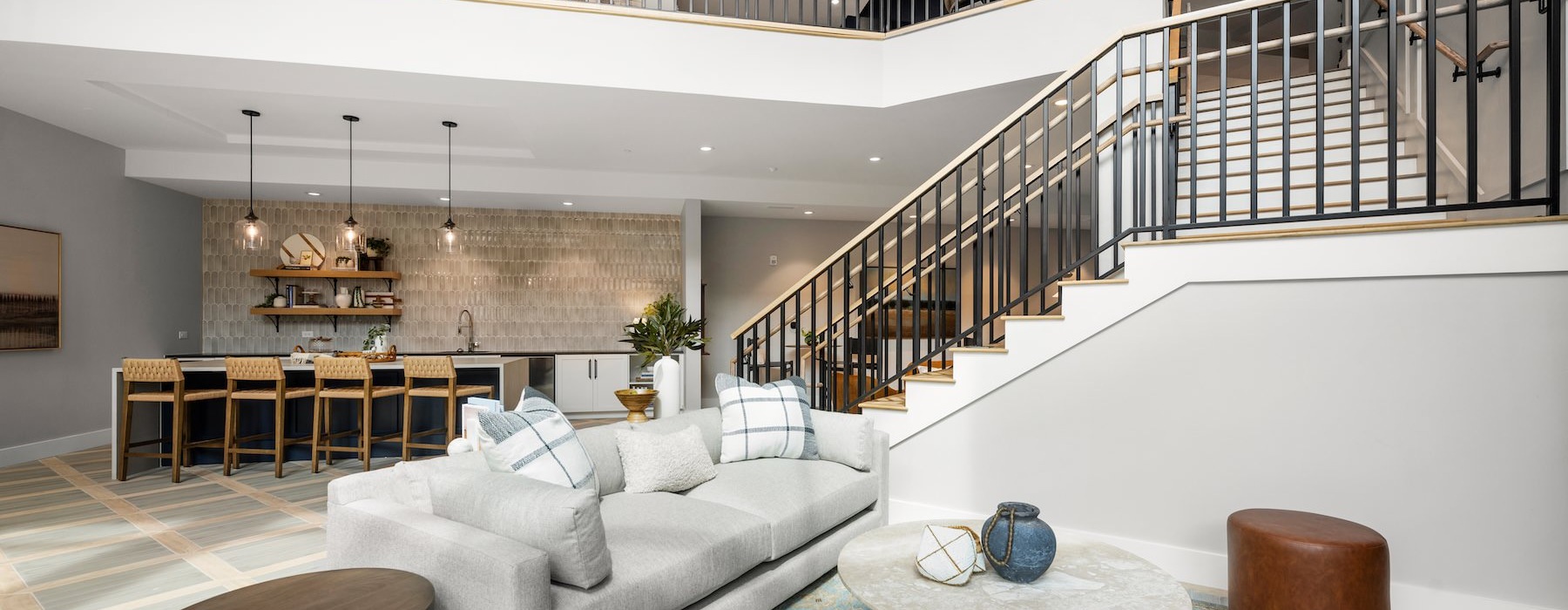 a clubroom with stairs and a couch