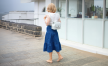 girl with blue dress and backpack