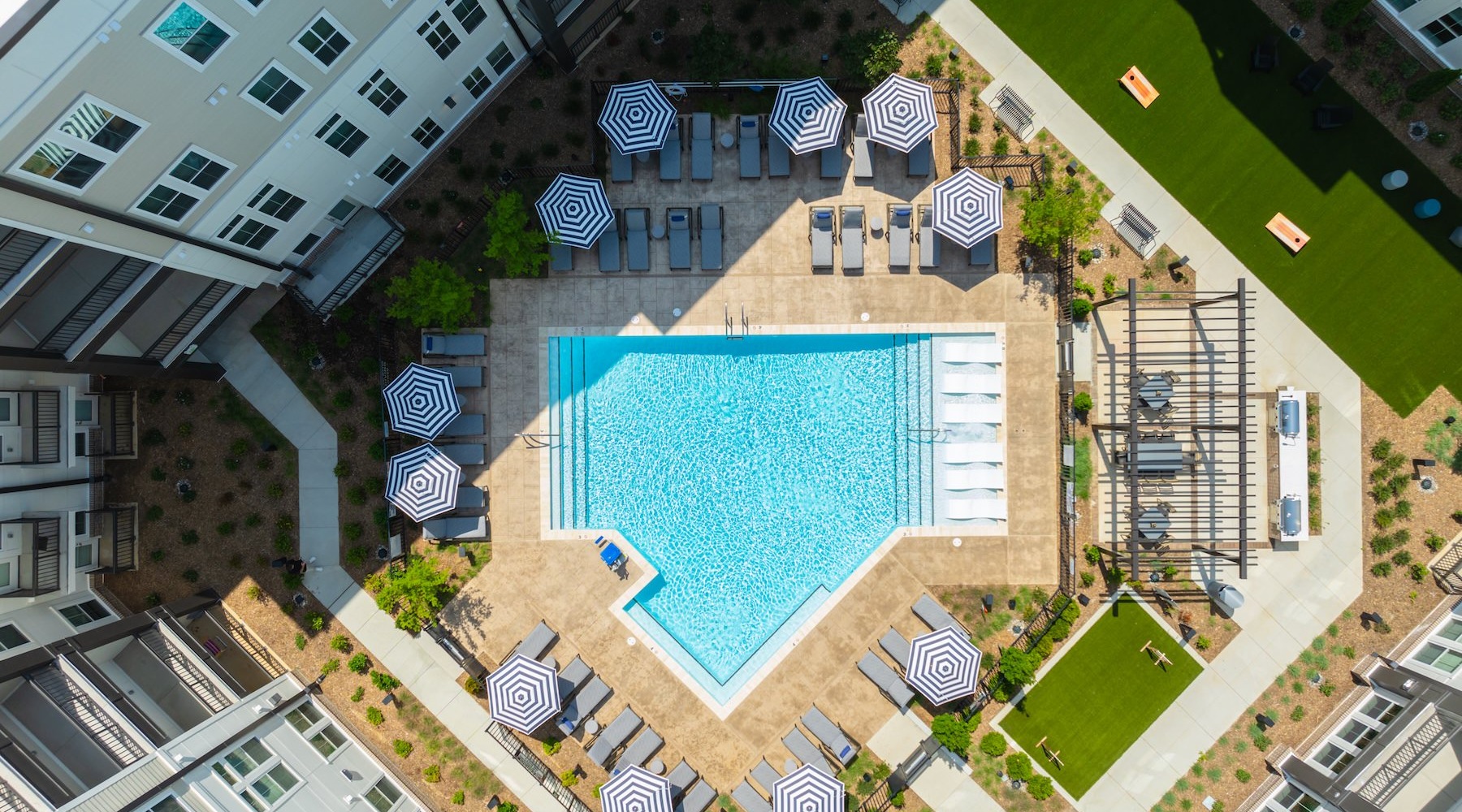 an aerial view of a swimming pool in a courtyard